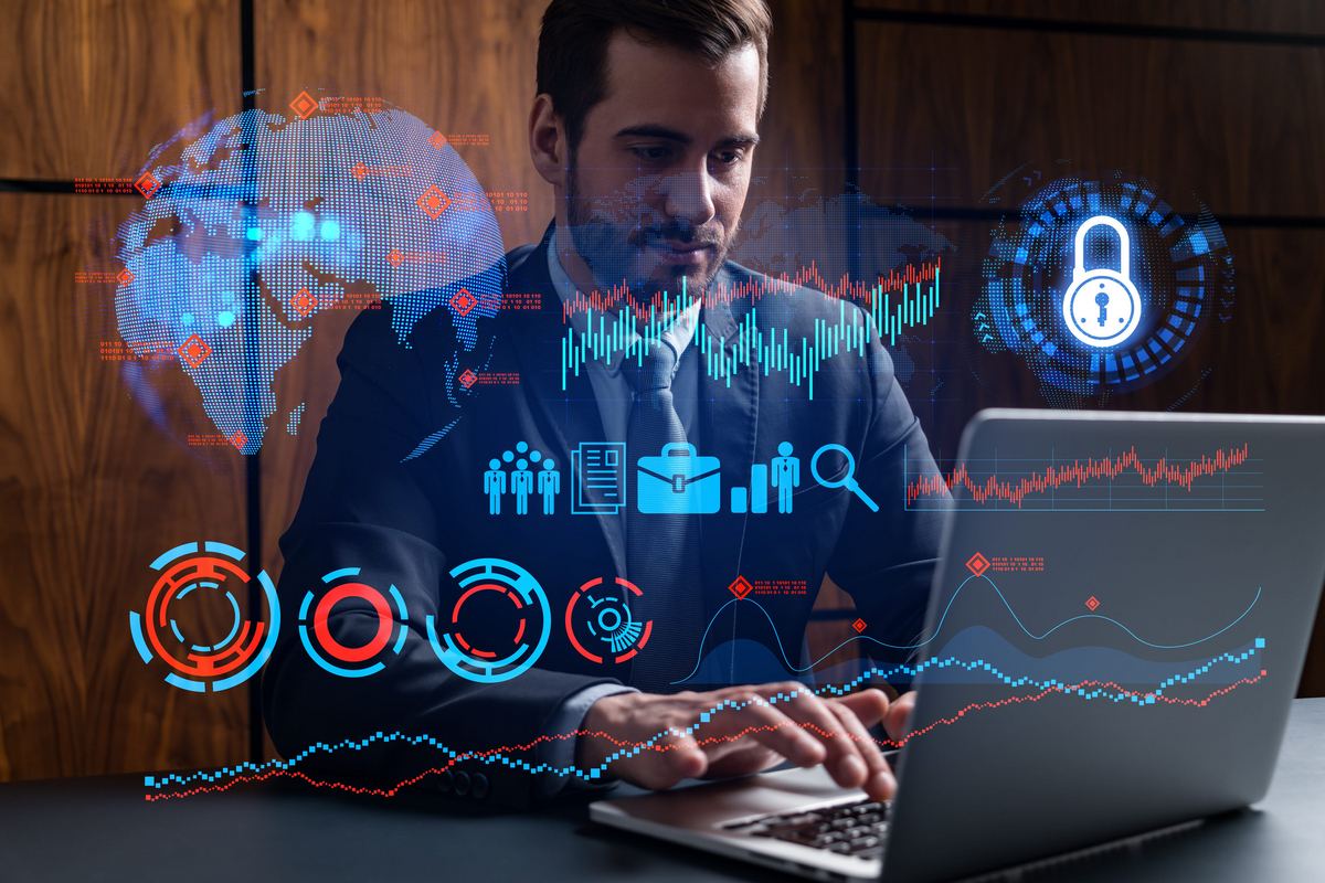 IT professional reviewing network security data on a laptop