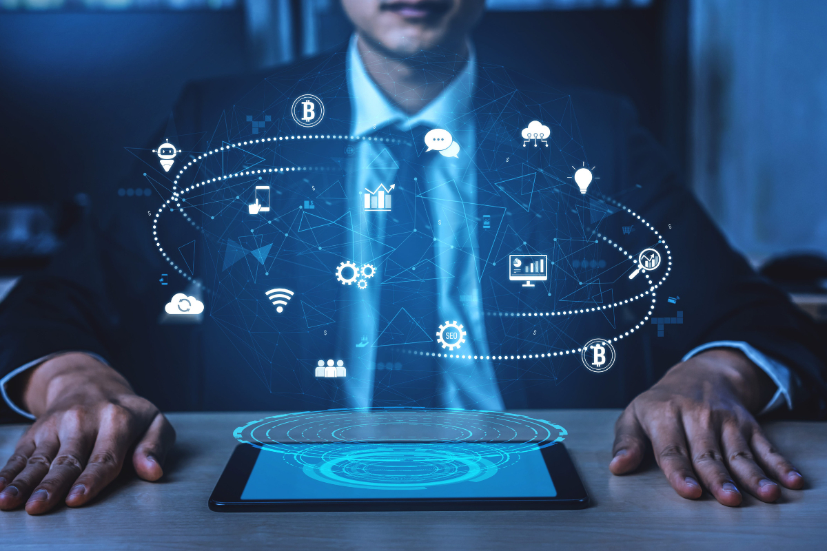 Business professional with a tablet connected to a cloud technology ecosystem