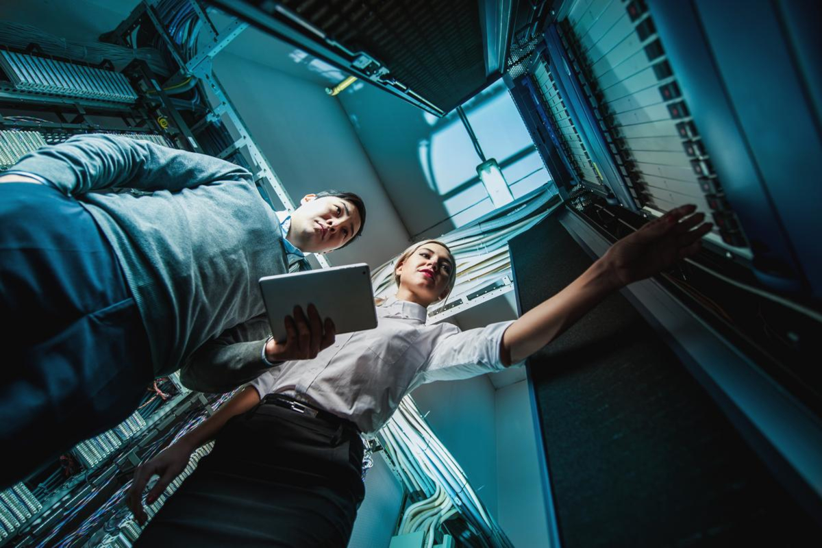 Two people in server room