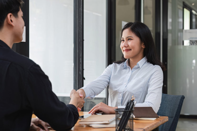 Handshake of cooperation between customer and salesman after successful agreement