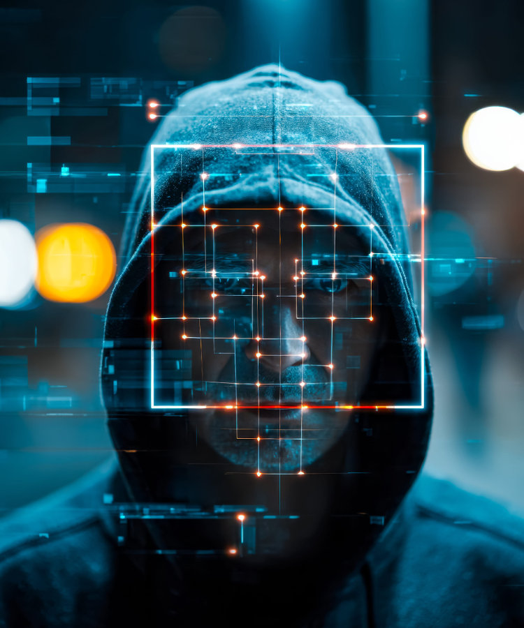 High-tech scene with concealed individual in hoodie with digital scanning overlays